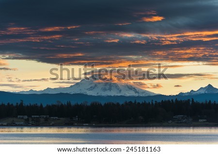 Mt. Baker Sunrise. A very dramatic sunrise paints Mt. Baker with a lovely warm hue. Taken from Lummi Island in the San Juan Islands of Puget Sound in western Washington State.