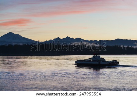 Ferryboat and Mt. Baker. At sunrise, the Lummi Island ferry, \