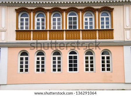 Facade with windows and wood carvings old wooden house made in the Russian tradition in a country town