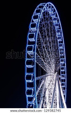 light blue Ferris Wheel at night time
