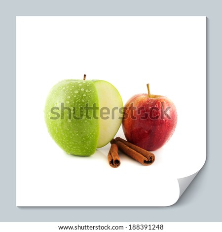 Isolated sliced green and red apple with cinnamon pods (white background). Fresh diet fruit (water drops). Healthy fruit with vitamins.