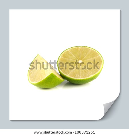 Isolated green lime with slice on a white background. Fresh diet fruit. Healthy fruit with vitamins.