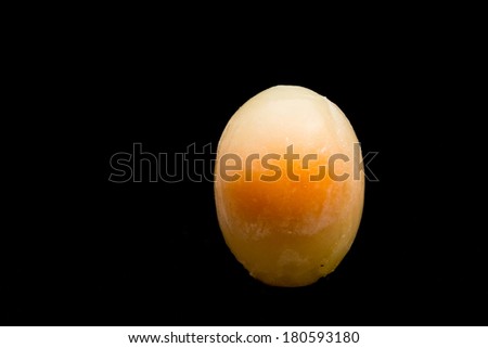 Frozen egg on black background