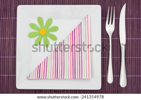 Purple table setting with napkin