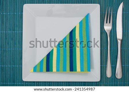 Cyan table setting with napkin