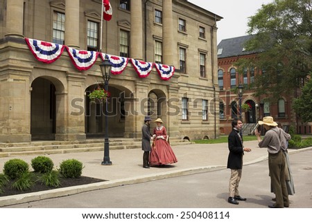 CHARLOTTETOWN, PRINCE EDWARD ISLAND/CANADA - JULY 7, 2014: The Confederation Players dressed as Fathers and Ladies of Confederation In Charlottetown in Prince Edward Island in Canada.