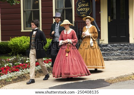 CHARLOTTETOWN, PRINCE EDWARD ISLAND/CANADA - JULY 7, 2014: The Confederation Players dressed as Fathers and Ladies of Confederation in Charlottetown, in Prince Edward Island, in Canada.