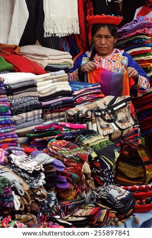 SICUANI, CUSCO/PERU - JANUARY 21, 2013: Peruvian traditional wares sold by a native woman.