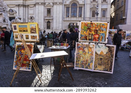 ROME, LAZIO/ITALY - APRIL 3, 2015: Artist selling paintings on Piazza Navona in Rome, Italy.