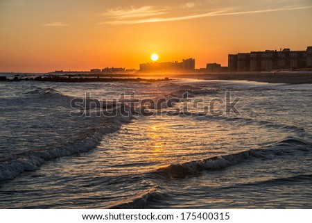 The sun setting over Rockaway Beach, Queens, New York