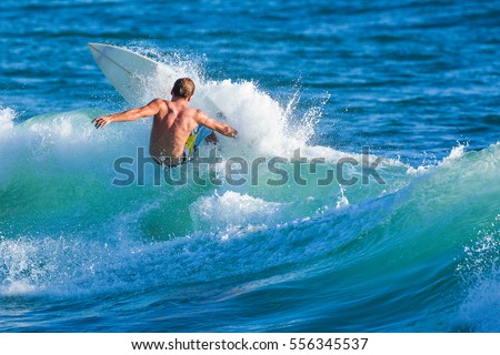 Riding the waves. Surfer, Costa Rica