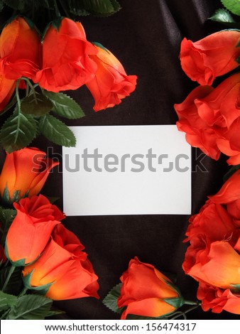 Red rose with petals and blank gift card for text