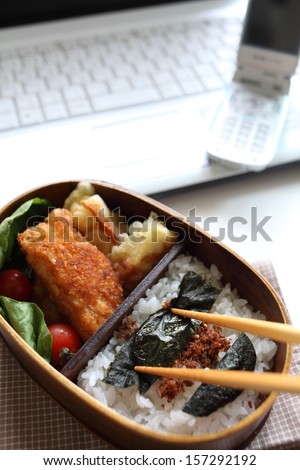 Japanese homemade rice packed lunch in traditional wooden box