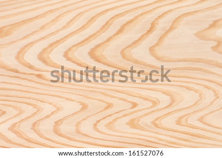 A peach colored wavy wood grain pattern, running from top to bottom.