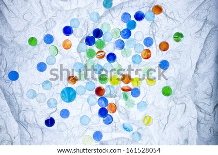 A white background covered with multi-colored spots.