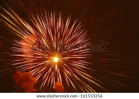 A firework that has just exploded, showing the smoke in the air.