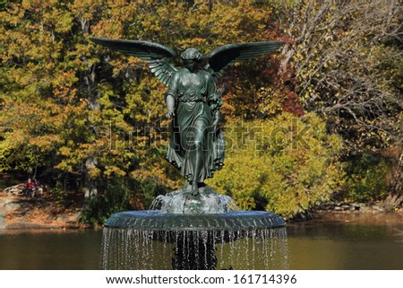 A water fountain with a winged statue.