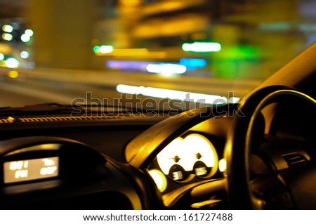 Selective focus of the dashboard of a car while the car moves.
