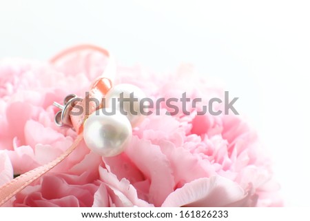 Pearl stud earrings on pink marzipan flower