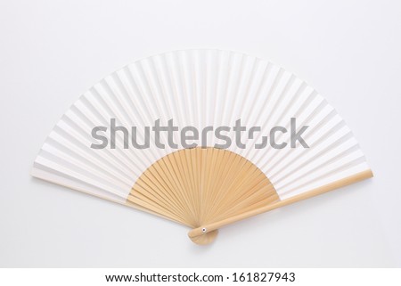 Folding fan on white background