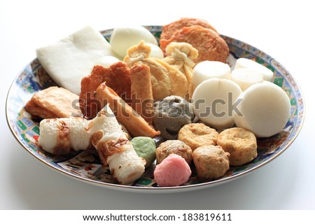 A patterned plate with various types of food displayed on it.