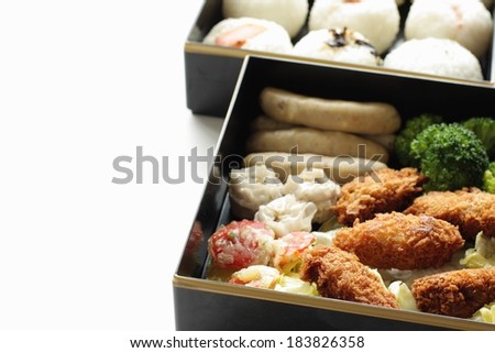 An appetizing meal is displayed in modern square containers.