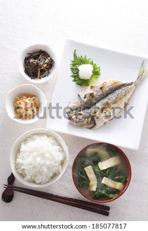 Various dishes to make a Chinese meal including soup, fish and rice.