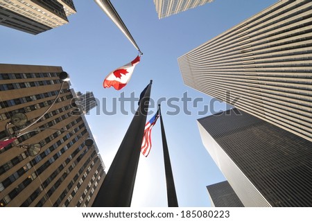 Sky scrapers with flags of different countries reaching for the sky.