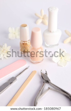 A bunch of nail polish with other cosmetic tools.