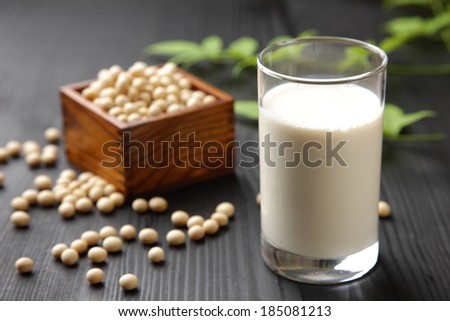 A glass of milk and a box of seeds.