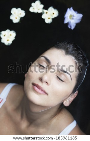 Flowers floating near woman's head (directly above)