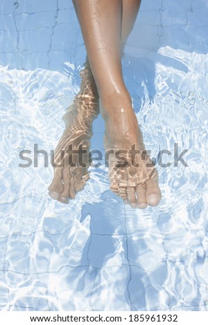 Woman's feet in water (focus on feet)