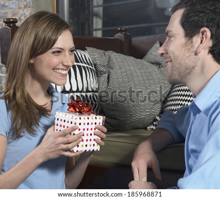 Mid-Adult Woman Receiving Gift from Boyfriend