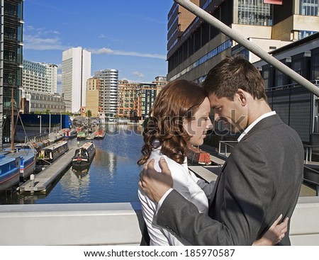 Mid Adult Couple Hugging at Bridge