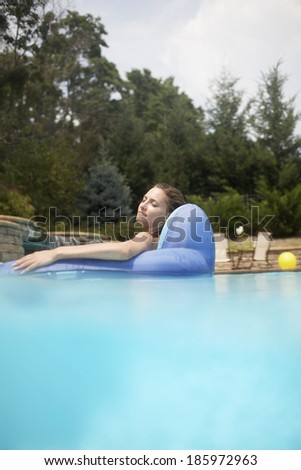 Mid-Adult Woman on Pool Raft