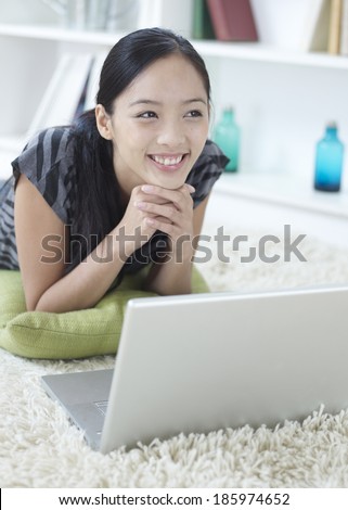 Woman Using Laptop and Day Dreaming