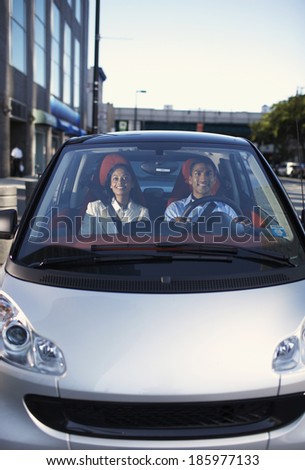 Mid-Adult Couple Driving Smart Car