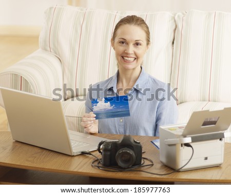 Mid-Adult Woman Printing Out Digital Photographs