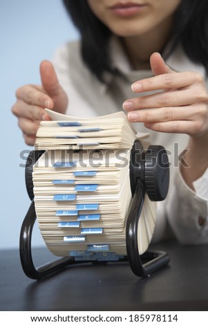Close-Up of Businesswoman Using Rotary Card File