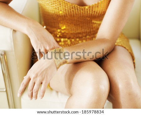 Close-Up of Woman in Golden Dress