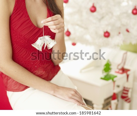 Close-Up of Woman Holding Christmas Decoration