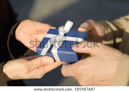 Japanese husband and wife giving present
