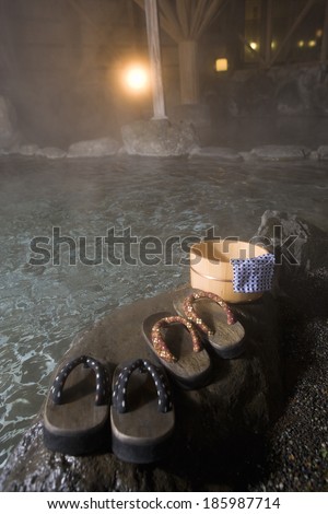 hot spring, bucket, towel, and wooden clogs