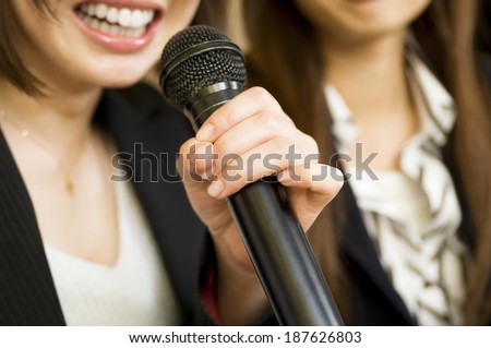 two women with microphone