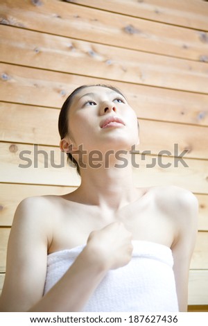 woman relaxing in sauna
