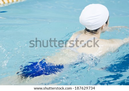 woman swimming in swimming pool