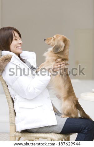 Miniature dachshund and woman