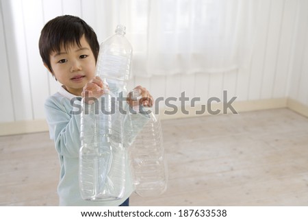 boy with plastic bottle