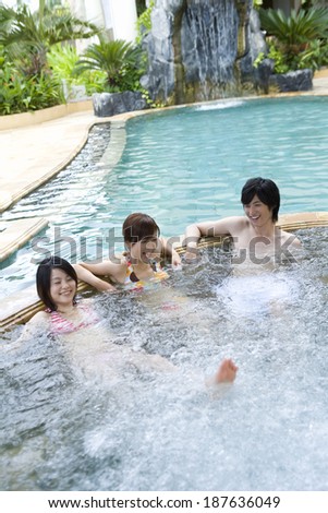 young people in swimming pool jacuzzi