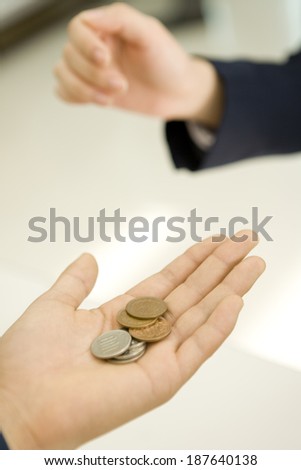 hand of person paying by cash
